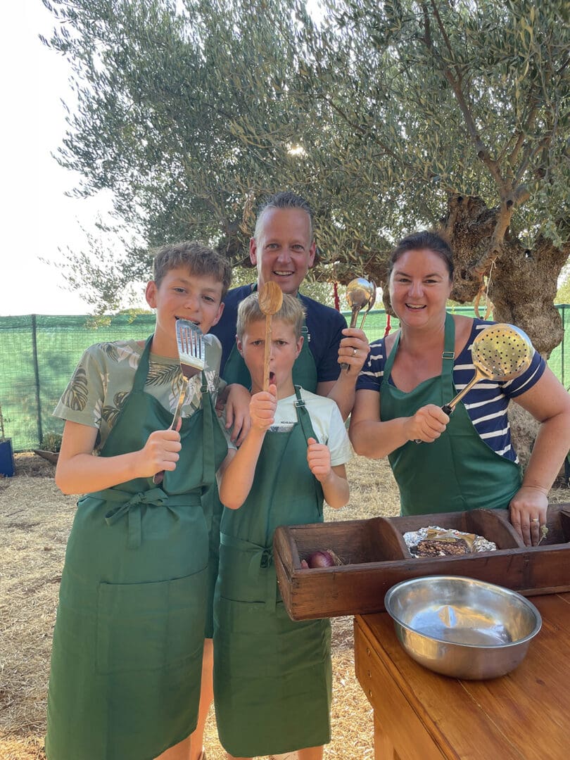 Families cooking traditional Kagianas together at Mama Gaia farm