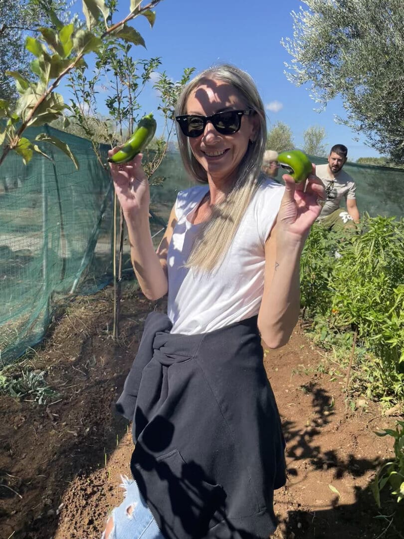 Guests harvesting fresh vegetables at Mama Gaia farm